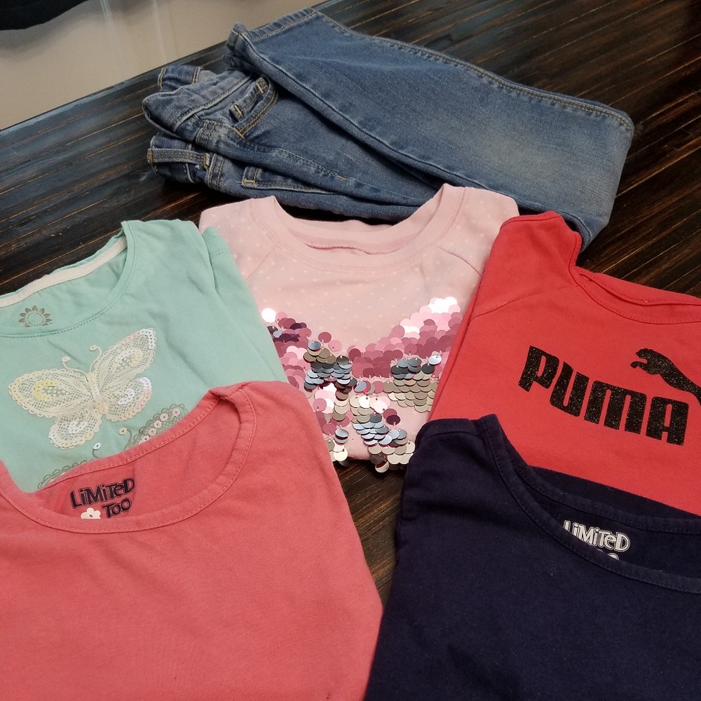 Five tops and one pair of girls jeans.